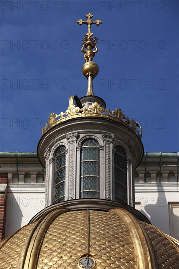 Poland, Krakow, Crucifix on dome of Wawel Cathedral.