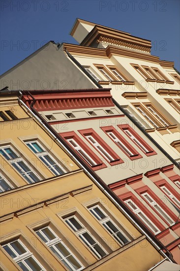 Poland, Krakow, pastel coloured buildings in the old city.