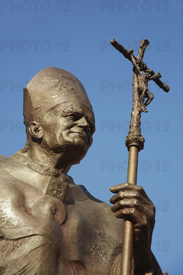 Poland, Krakow, statue of Pope John Paul II in the courtyard of Wawel Cathedral.