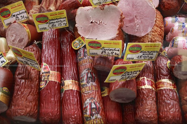 Poland, Krakow, display of cold meats in Stary Kleparz market.