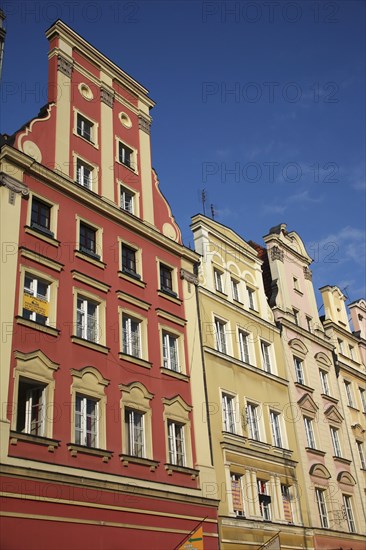 Poland, Wroclaw, pastel coloured building facades in the Rynek old town square.