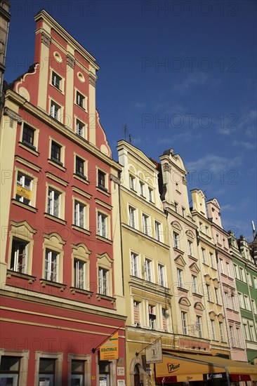 Poland, Wroclaw, pastel coloured building facades in the Rynek old town square.