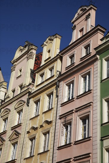 Poland, Wroclaw, pastel coloured building facades in the Rynek old town square.