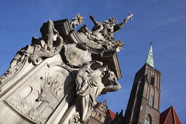 Poland, Wroclaw, baroque statue of St Jan Nepomucen St John Nepomuk made in sandstone by Johann Georg Urbansky in 1732 in front of the Church of the Holy Cross and St Bartholomew.