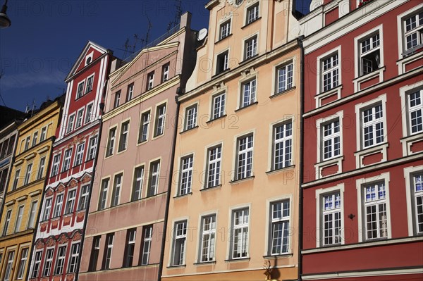 Poland, Wroclaw, pastel coloured building facades in the Rynek old town square.