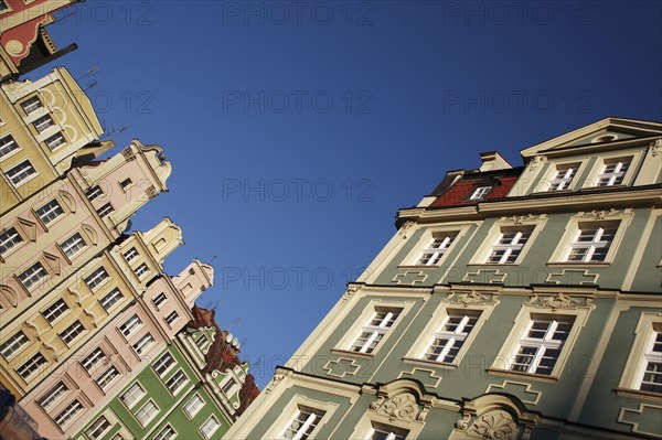 Poland, Wroclaw, angled view of pastel coloured building facades in the Rynek old town square.