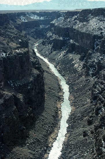 USA, New Mexico, Rio Grande River, View along river near Taos showing deeply eroded banks and bed.