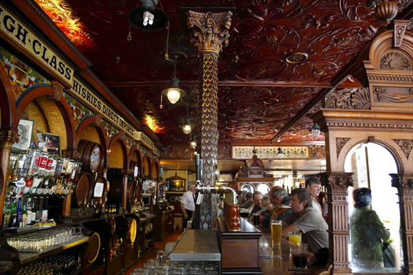 Ireland, North, Belfast, Great Victoria Street, The Crown Bar Liquor Saloon. Built in 1826 it features gas lamps and cosy snugs.