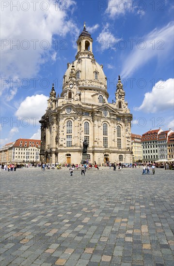 GERMANY, Saxony, Dresden, The restored Baroque church of Frauenkirch Church of Our Lady and surrounding restored buildings in Neumarkt square busy with sightseeing tourists.
