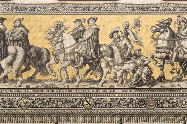 GERMANY, Saxony, Dresden, Fürstenzug or Procession of the Dukes in Auguststrasse a mural on 25,000 Meissen tiles that depicts 35 noblemen from the 12th century Konrad the Great, to Friedrich August III, Saxony's last king, who ruled from 1904-1918. It was originally painted by Wilhelm Walter between 1870 and 1876 but eventually, the stucco began to crumble and around 1906-07 it was replaced by the tiles.