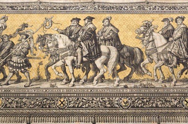 GERMANY, Saxony, Dresden, Fürstenzug or Procession of the Dukes in Auguststrasse a mural on 25,000 Meissen tiles that depicts 35 noblemen from the 12th century Konrad the Great, to Friedrich August III, Saxony's last king, who ruled from 1904-1918. It was originally painted by Wilhelm Walter between 1870 and 1876 but eventually, the stucco began to crumble and around 1906-07 it was replaced by the tiles.