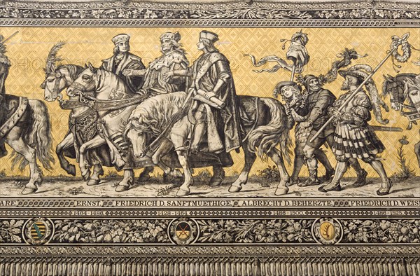 GERMANY, Saxony, Dresden, Fürstenzug or Procession of the Dukes in Auguststrasse a mural on 25,000 Meissen tiles that depicts 35 noblemen from the 12th century Konrad the Great, to Friedrich August III, Saxony's last king, who ruled from 1904-1918. It was originally painted by Wilhelm Walter between 1870 and 1876 but eventually, the stucco began to crumble and around 1906-07 it was replaced by the tiles.