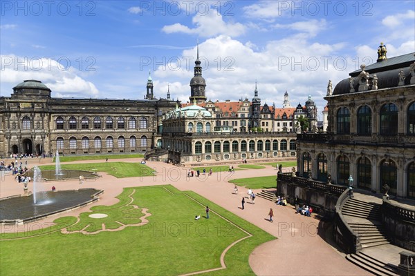 GERMANY, Saxony, Dresden, The central Courtyard of the restored Baroque Zwinger Palace gardens busy with tourists originally built between 1710 and 1732 after a design by Matthäus Daniel Pöppelmann in collaboration with sculptor Balthasar Permoser.