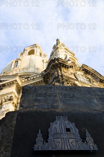 GERMANY, Saxony, Dresden, Detail in evening light of the Baroque Frauenkirche Church of Our Lady dome in Neumarkt square with the Karl Pinkert Stone in the foreground showing where it was the only remaining piece of the original dome.
