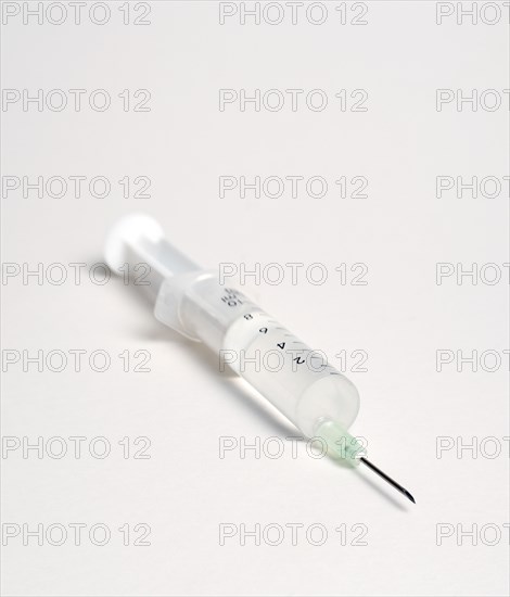 Health, Medicine, Medical Instruments, Hypodermic syringe with needle on a white background.