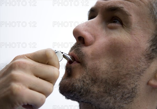 Sport, Ball Games, Referees, Male referee blowing whistle.