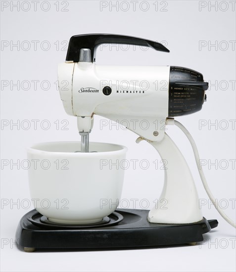 Food Preparation, Cooking, Kitchen Equipment, Sunbeam Mixmaster electric food blender or mixer circa 1953 on a white background.