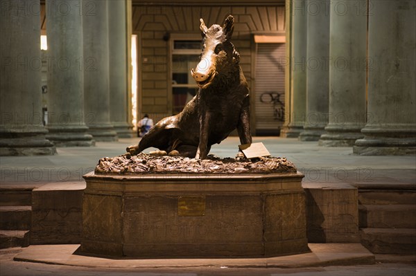 ITALY, Tuscany, Florence, The 17th century bronze fountain called Il Porcellino in the Mercato Nuovo, the New Market, also known as the Straw Market. The snout of the bronze wild boar shines because of the superstition that visitors who rub it will return some day.