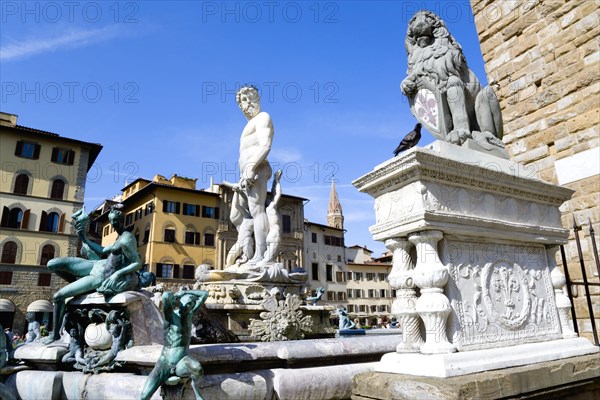 ITALY, Tuscany, Florence, The 1575 Mannerist Neptune fountain with the Roman sea God surrounded by water nymphs commemorating Tuscan naval victories by Ammannatti in the Piazza della Signoria beside the Palazzo Vecchio.