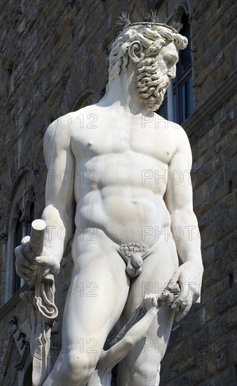 ITALY, Tuscany, Florence, The 1575 Mannerist Neptune fountain with the Roman sea God commemorating Tuscan naval victories by Ammannatti in the Piazza della Signoria beside the Palazzo Vecchio.