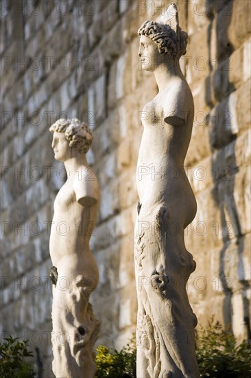 ITALY, Tuscany, Florence, Armless male and female statues outside the Palazzo Vecchio in the Piazza della Signoria.