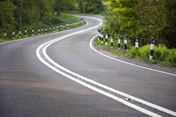 Transport, Roads, Country, A283 Washington Road single carriageway road with double white lines in the centre bending around a corner.