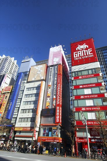 Japan, Tokyo, Akihabara, line of electric and computer stores on chuo-dori avenue.