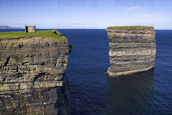 IRELAND, County Mayo, Downpatrick Head, Dún Briste Broken Fort is an impressive sea stack at the headland Standing 50 meters 164 feet high, Dún Briste was once part of the mainland, and connected to it by a sea arch.