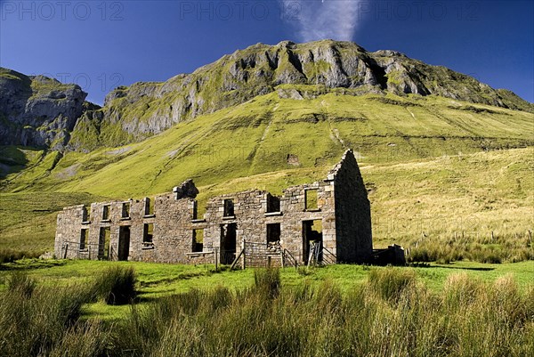 IRELAND, County Sligo, Gleniff, Gleniff Horseshoe, ruin which was formerly a school for minerís children  Ben Bulben in background.