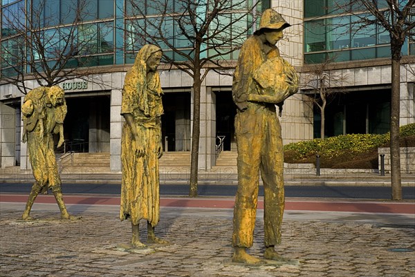 IRELAND, County Dublin, Dublin City, Famine Memorial  The sculpture is dedicated to a million Irish people forced to emigrate during the 19th century Irish Famine, bronze sculptures were designed and crafted by Dublin sculptor Rowan Gillespie, presented to the City of Dublin in 1997.
