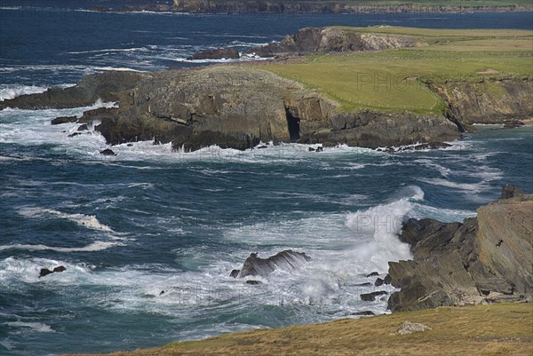 IRELAND, County Kerry, Dingle Peninsula, Crashing waves at Clogher Head.