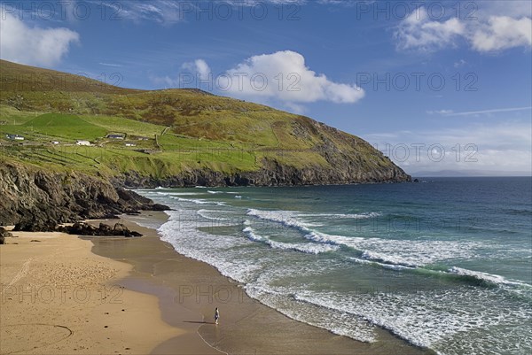 IREland, County Kerry, Dingle Peninsula, Coumeenole Beach at Slea Head  Figure on beach with incoming waves.