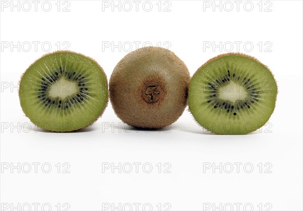 FOOD, Fruit, Kiwifruit, Whole and section through kiwi showing seeds and flesh.