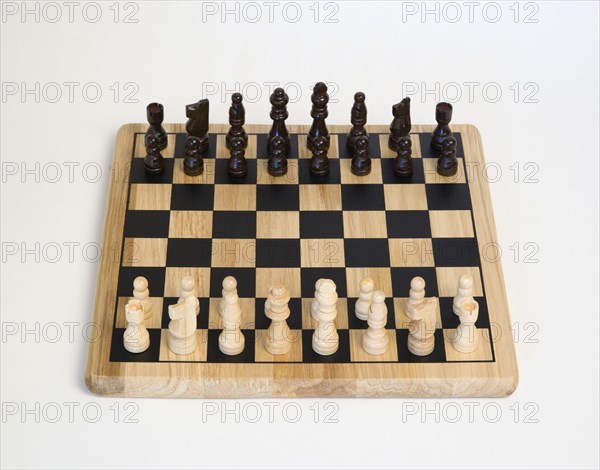 Toys, Games, Board Games, Chess board with pieces laid out for start of game against a white background.