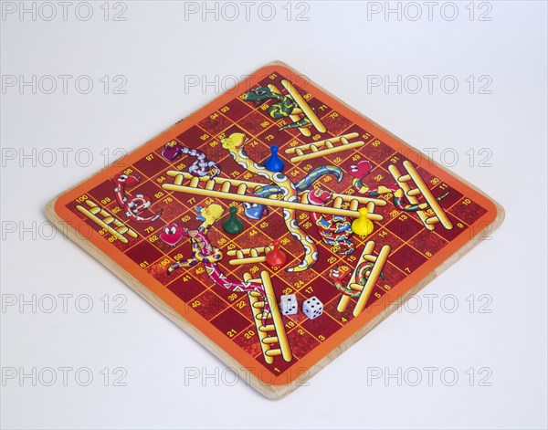 Toys, Games, Board Game, Snakes and Ladders board game with dice and counters for children against a white background.