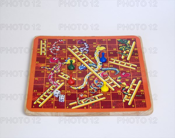 Toys, Games, Board Game, Snakes and Ladders board game with dice and counters for children against a white background.