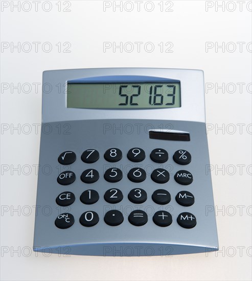 Business, Office Equipment, Calculator, Solar powered digital calculator on a white background.