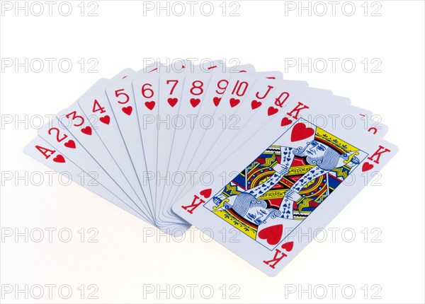 Toys, Games, Playing Cards, Cards in the suit of hearts fanned out in numerical order against a white background.