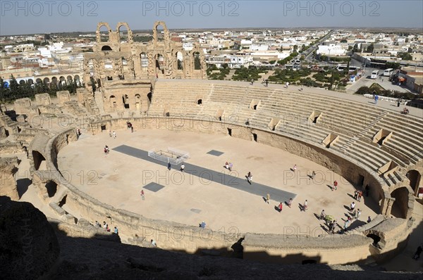 Tunisia, El Jem, Roman Colosseum with tourists.