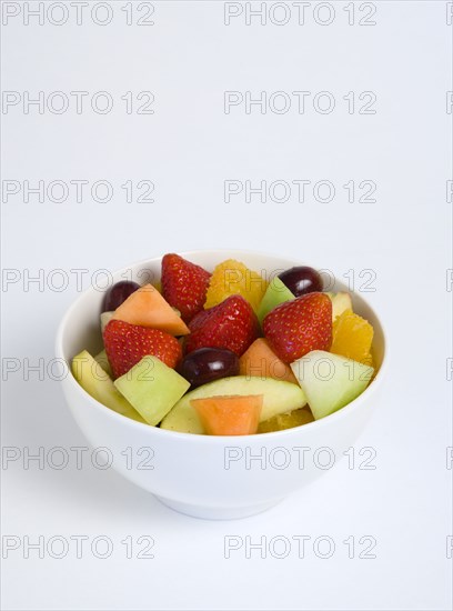 Food, Fruit, Salad, White bowl of fresh fruit salad on a white background.