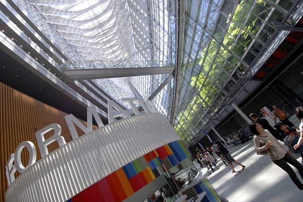 Japan, Tokyo, Yurakucho, inside the International Forum Building, the enormous atrium lobby, all glass, information booth.