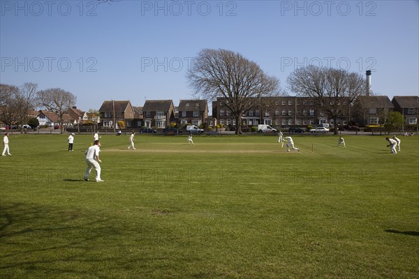 England, West Sussex, Southwick, Local Cricket team playing on village green.