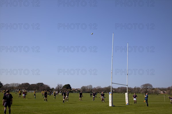 England, West Sussex, Shoreham-by-Sea, Rugby Teams playing on Victoria Park playing fields.