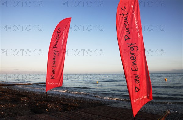 England, West Sussex, Goring-by-Sea, Worthing Triathlon 2009,  Flags marking start of the swim portion of the race.