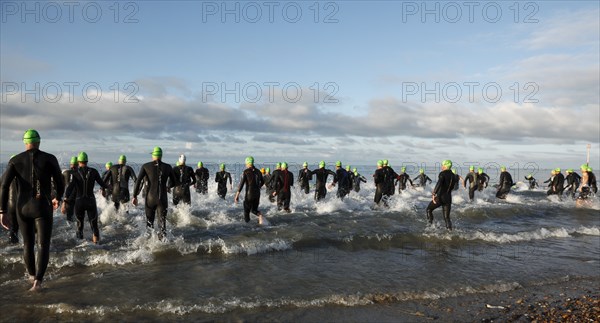 England, West Sussex, Goring-by-Sea, Worthing Triathlon 2009, male competitors at the swim start.