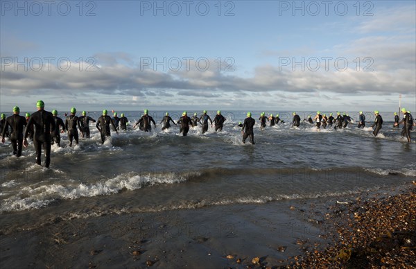 England, West Sussex, Goring-by-Sea, Worthing Triathlon 2009, male competitors at the swim start.