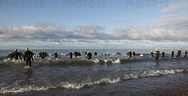 England, West Sussex, Goring-by-Sea, Worthing Triathlon 2009, male competitors at the swim start.