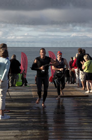 England, West Sussex, Goring-by-Sea, Worthing Triathlon 2009, male competitors at the swim exit.