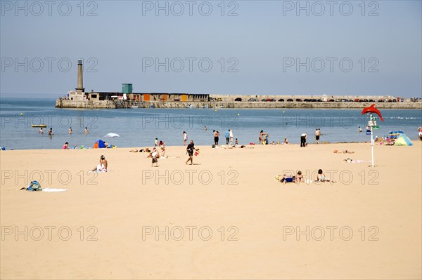England, Kent, Margate beach with sunbathers.