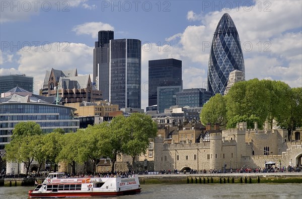 England, London, Tower Bridge, View across River Thames and Tower of London toward the City financial district with the Gherkin visible.